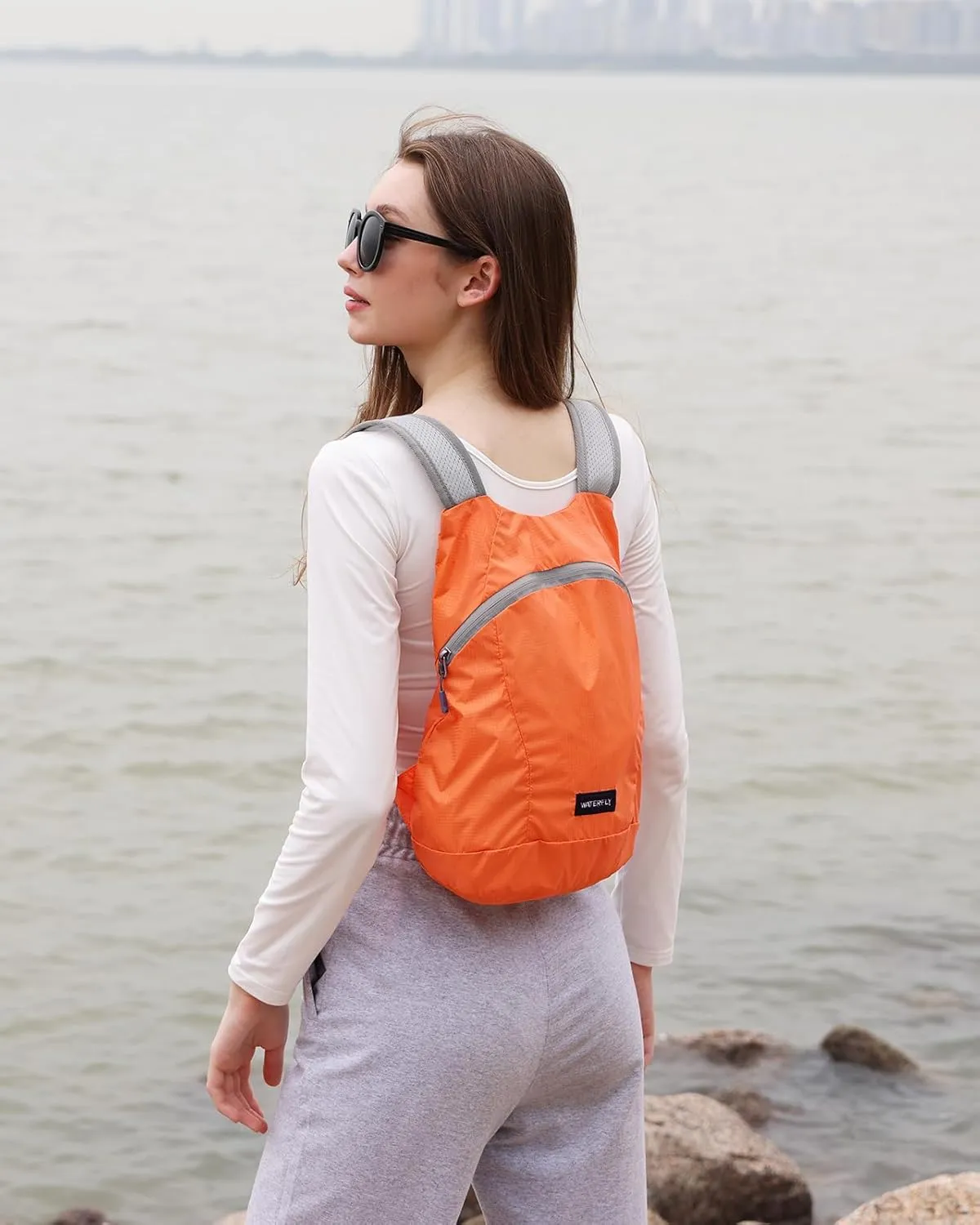 WATERFLY Foldable Lightweight Hiking Backpack: 15L Packable Traveling Daypack Men Women Ultralight Thin Casual Day Pack Bag for Outdoor Sports Camping Beach Park (Orange)